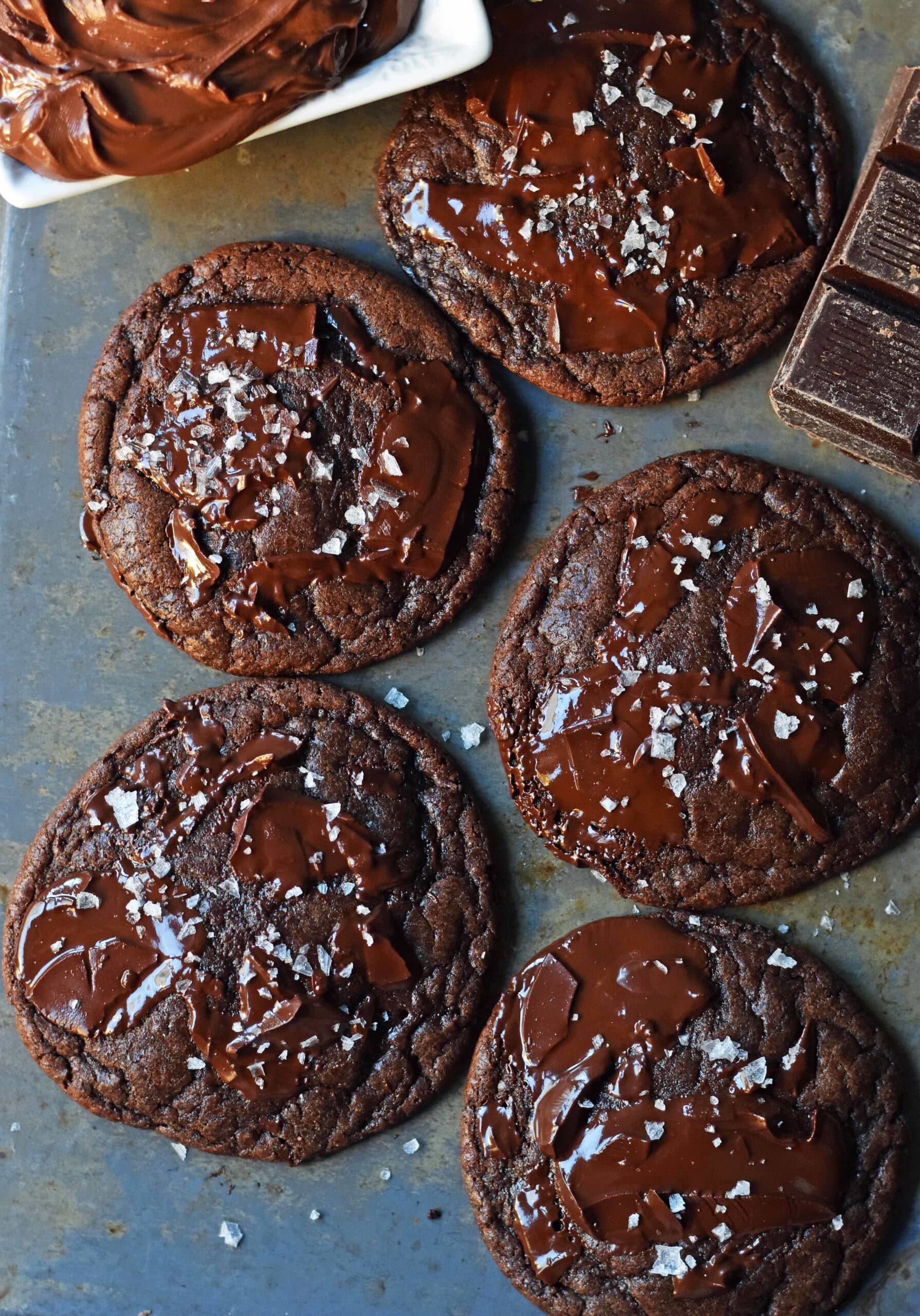 Double chocolate cookies on pan with sea salt.