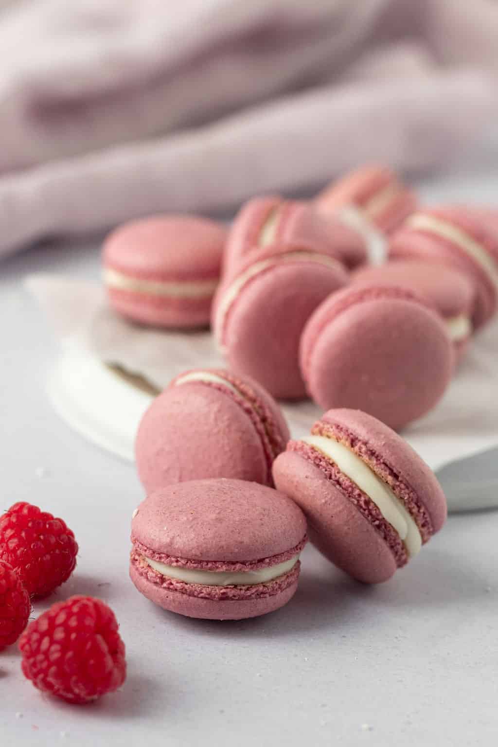 Lots of pink raspberry macarons.