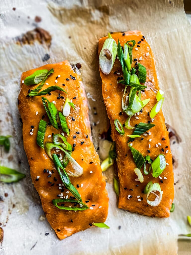 Miso salmon with sliced green onions and sesame seeds.