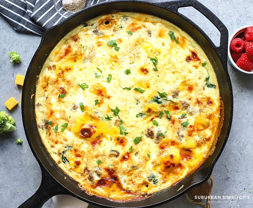 Sausage fritatta with veggies in a cast iron pan.