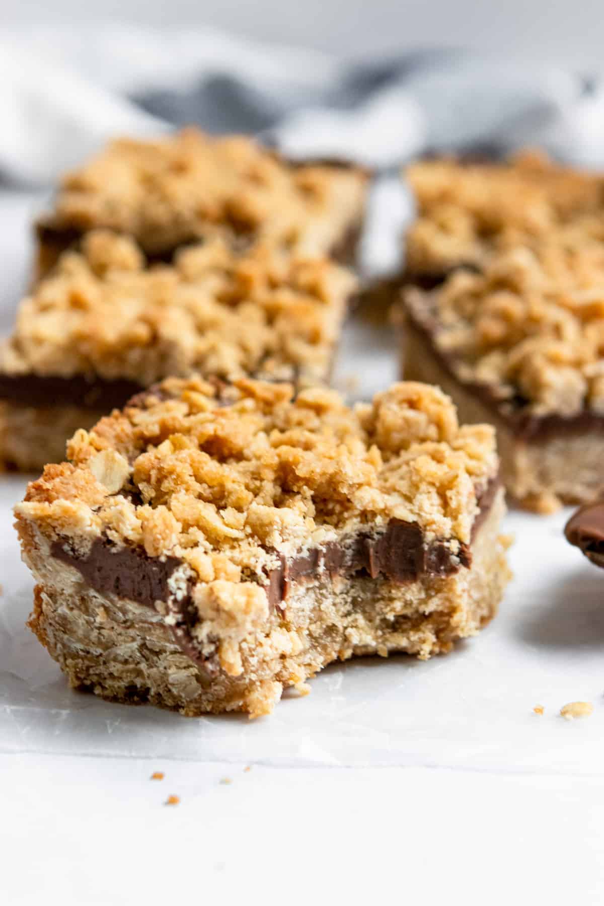 Nutella crumble bars on parchment paper.