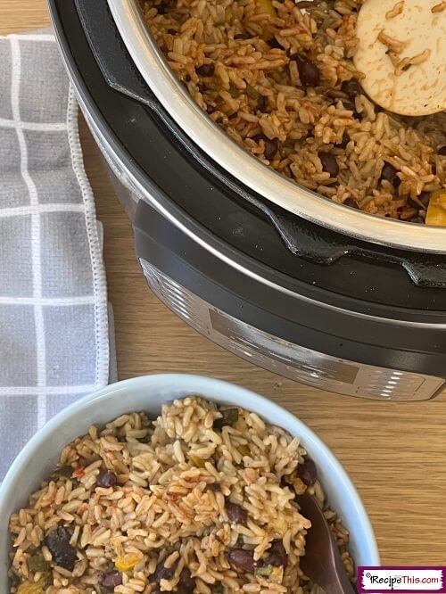 Black beans and rice with Instant Pot in the background.