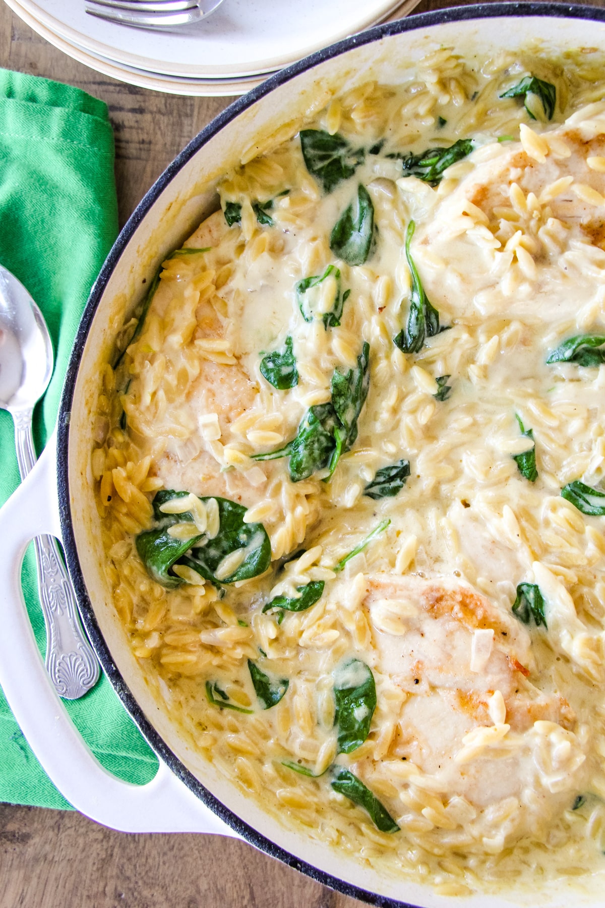 Creamy chicken orzo in a white pot.