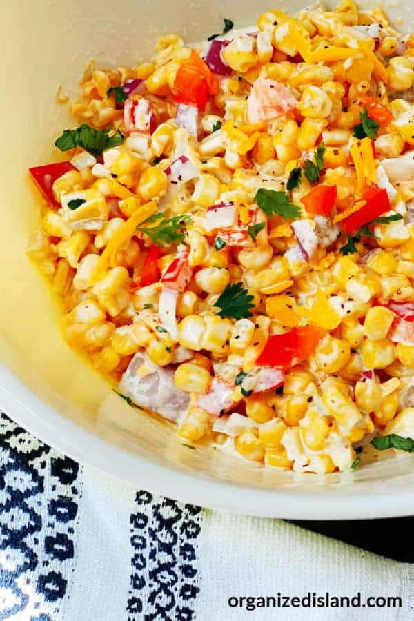 Cheesy corn dip in a bowl.