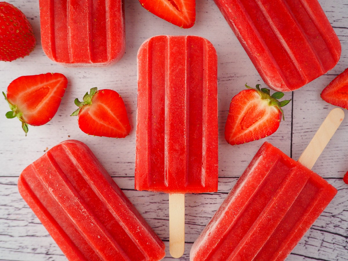 Strawberry popsicles on a white background.