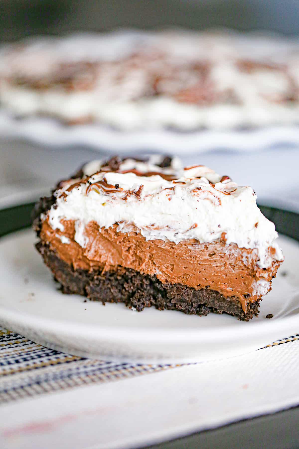 Slice of Nutella cream pie on a plate.