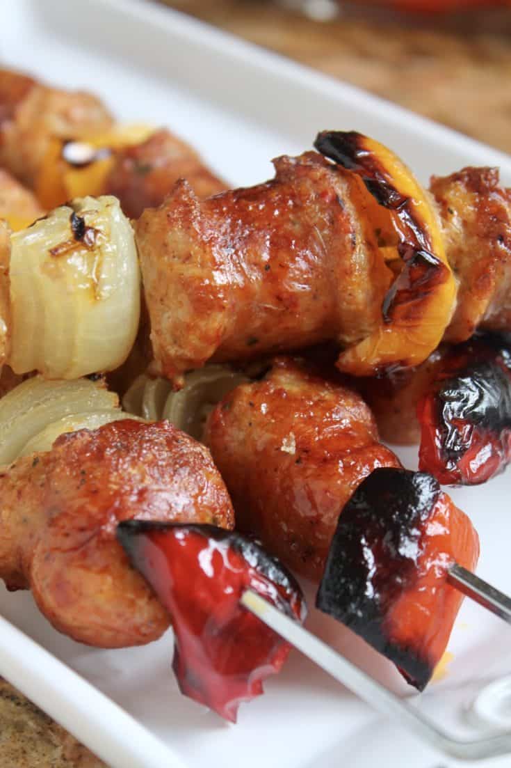 Italian sausage skewers on a platter.