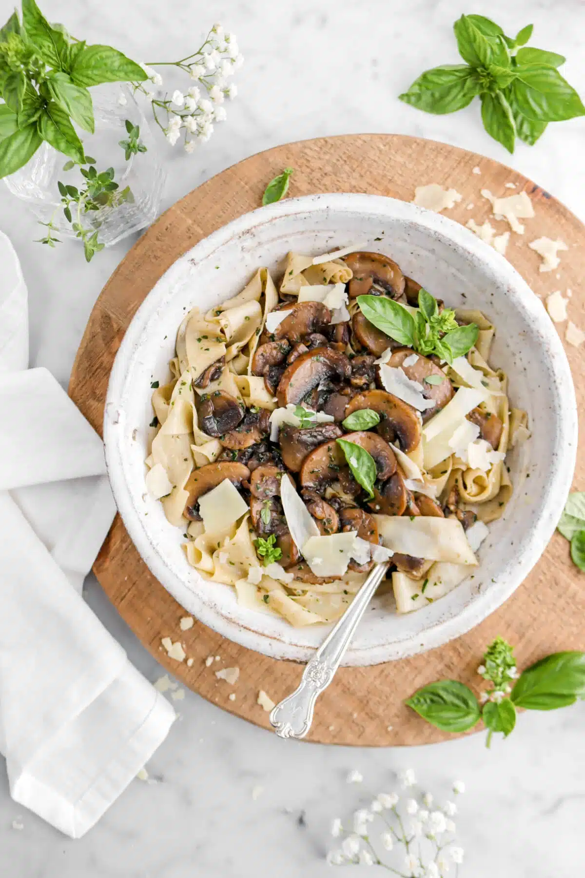 Tagliatelle pasta with herbed brown butter mushroom sauce in a bowl.