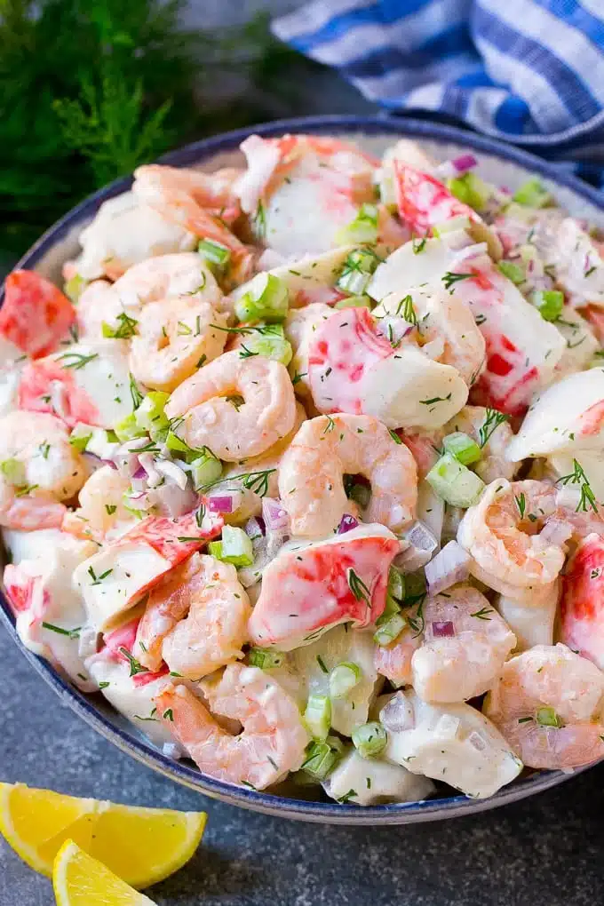 Imitation crab and shrimp salad in a bowl.