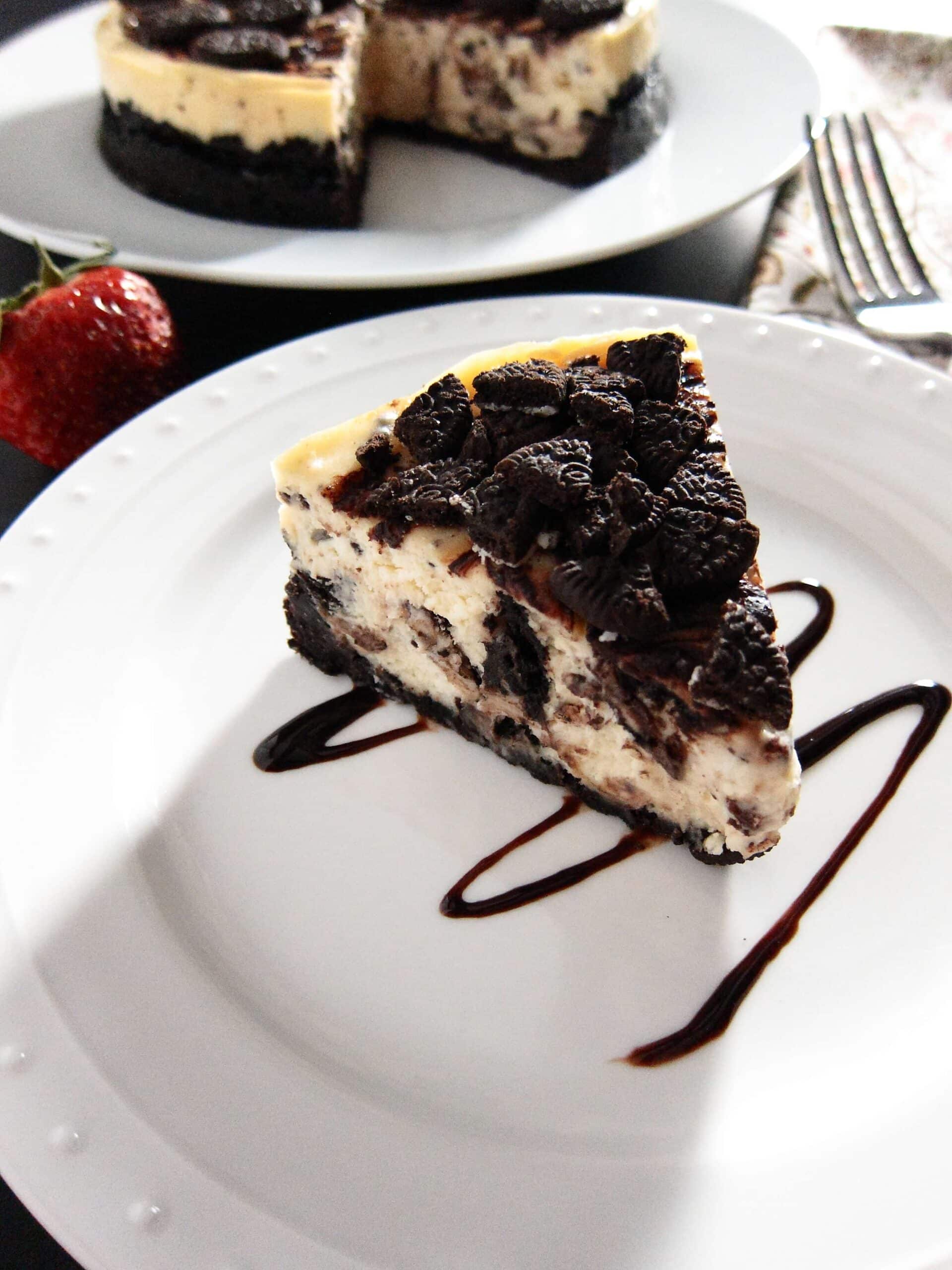 Slice of Instant Pot Oreo cheesecake  on a white plate.