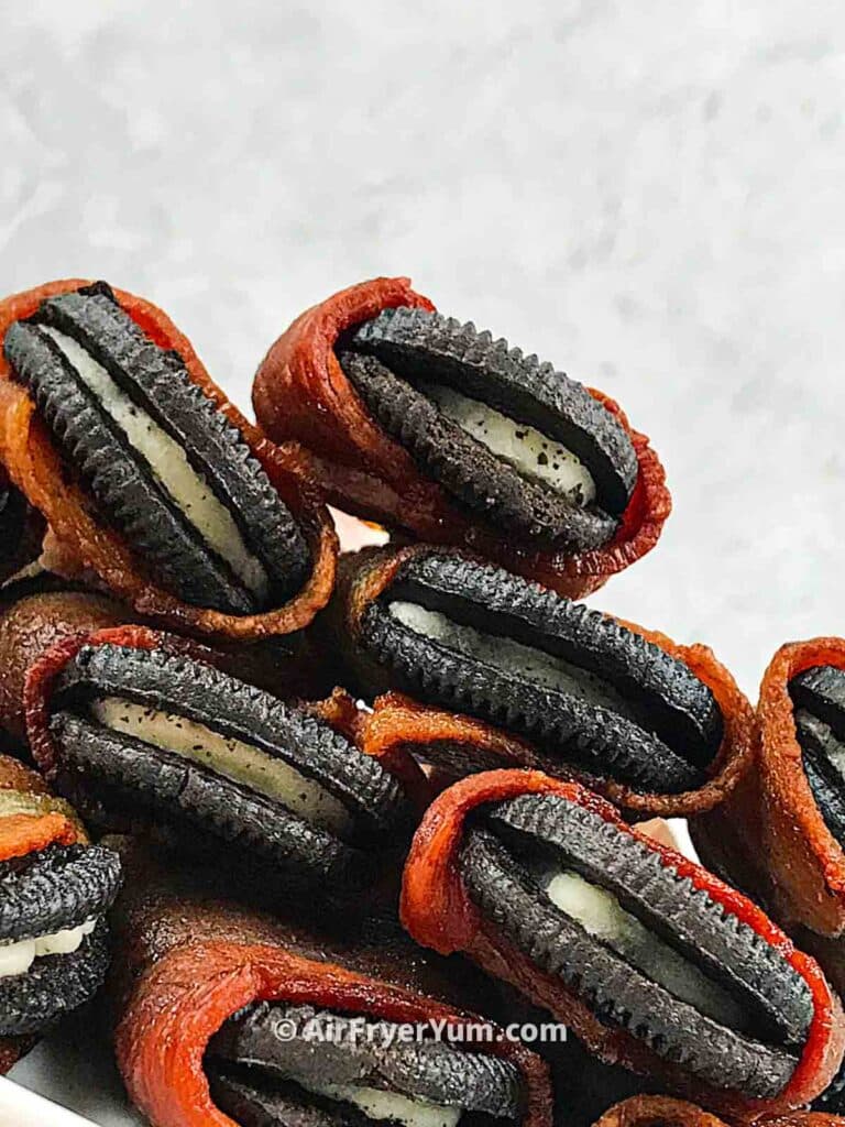 Stack of air fryer bacon wrapped Oreos.