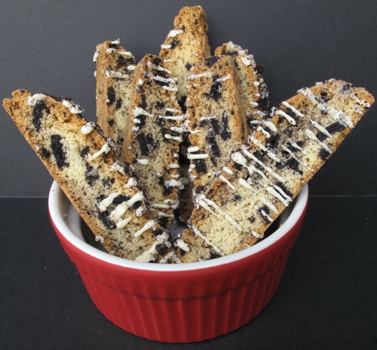 Oreo Biscotti in a red ramekin.