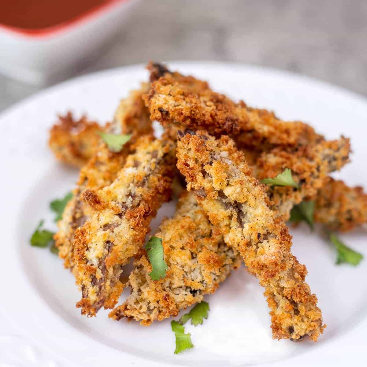 Air fryer portobello fries on a white plate.