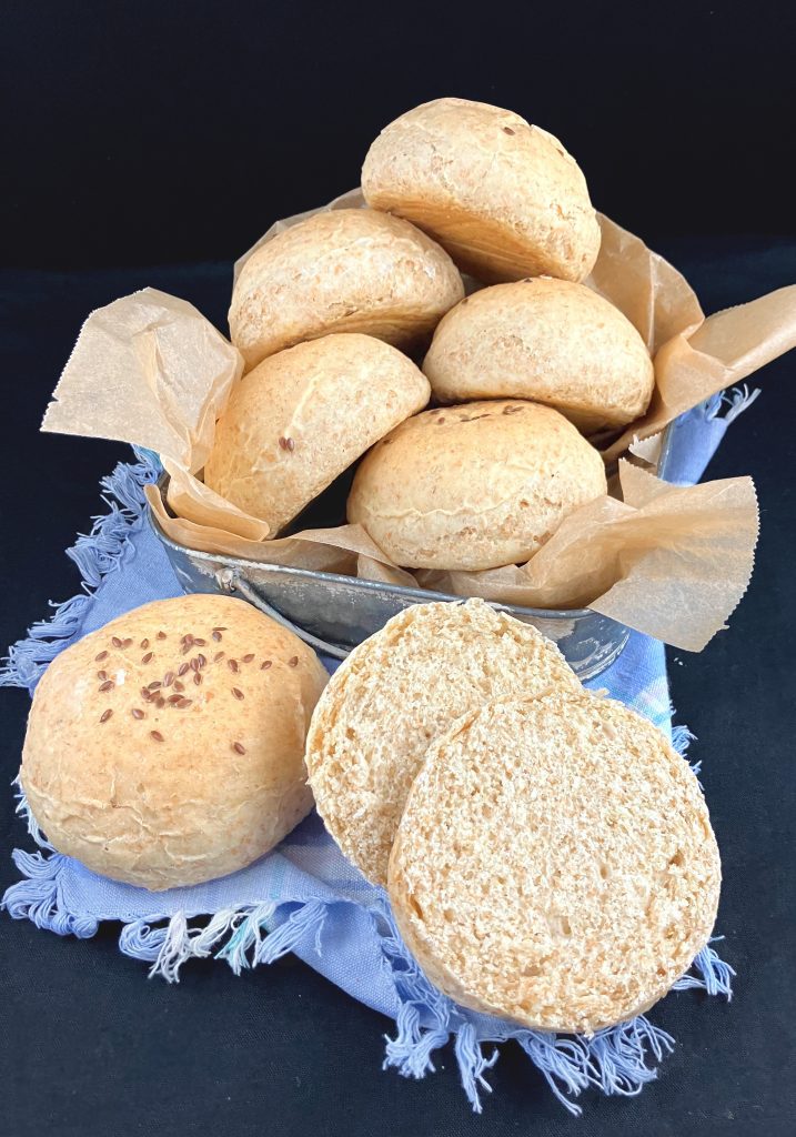 Wholegrain spelt and oat buns in a basket.