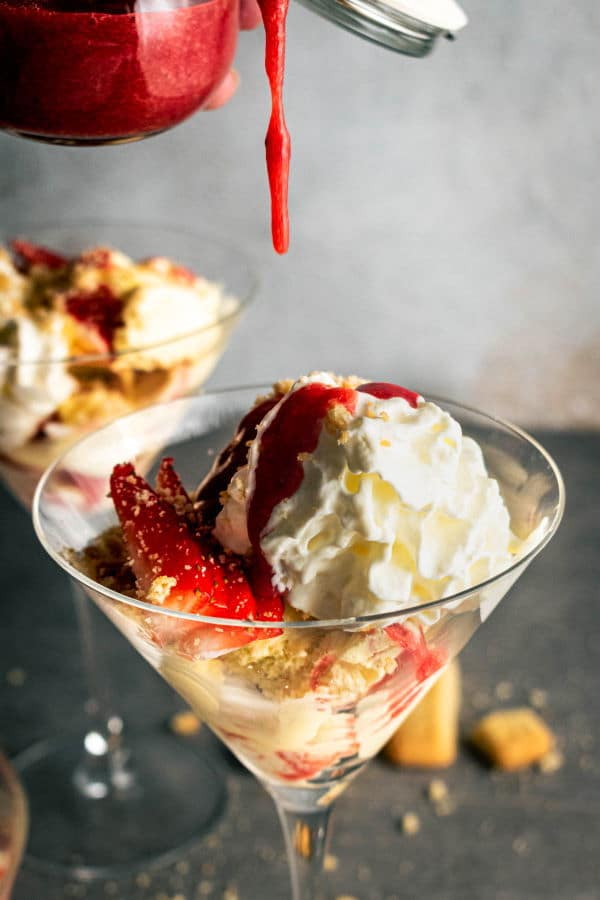 Strawberry shortcake ice cream servings in  martini glasses.
