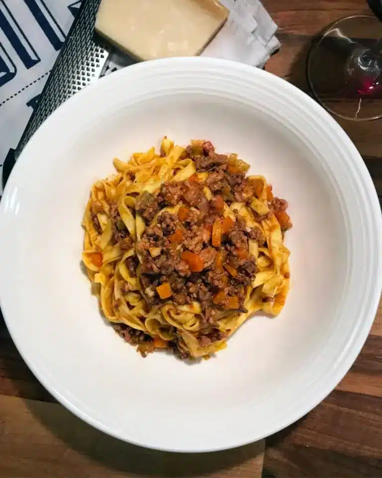 Bolognese ragu on a white plate.