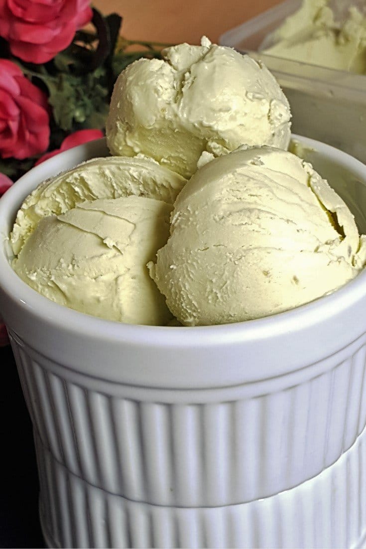 Avocado ice cream in a white ramekin.