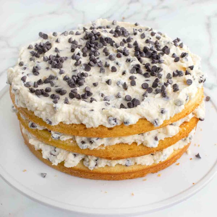 Cannoli Cake on a cake stand.