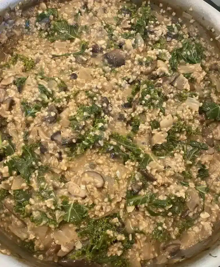 Rissoto-like vegan steel cut oats with mushrooms, leeks, and kale.