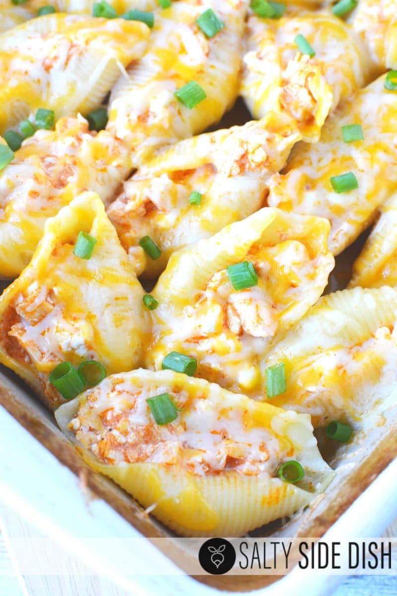 Buffalo chicken stuffed shells with diced green onion.