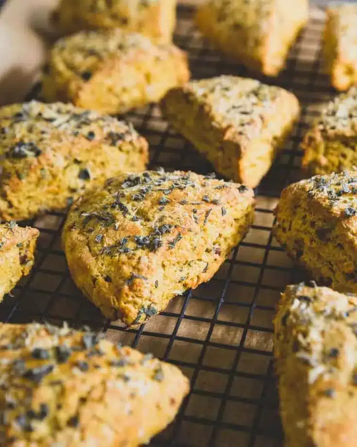 Parmesan pumpkin scones on a cooling rack.