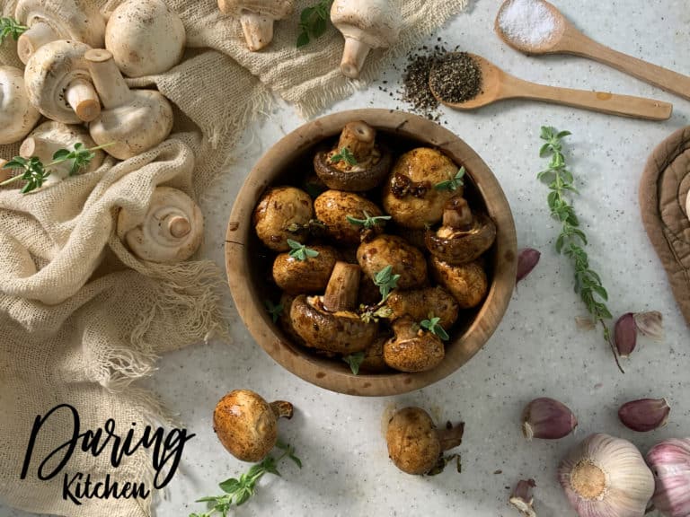 Balsamic soy roasted garlic mushrooms in a wooden bowl.