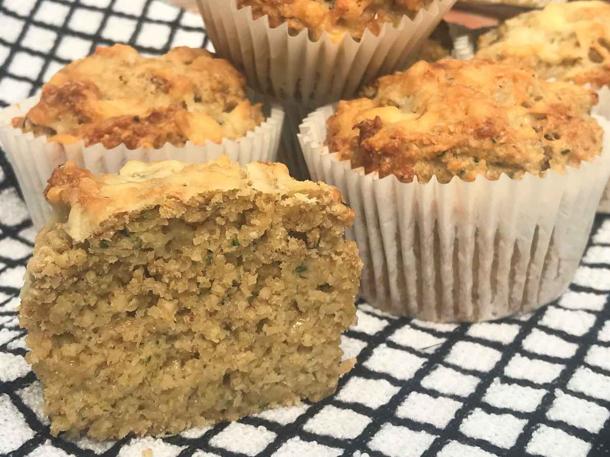 Cheese and zucchini muffins on a towel.