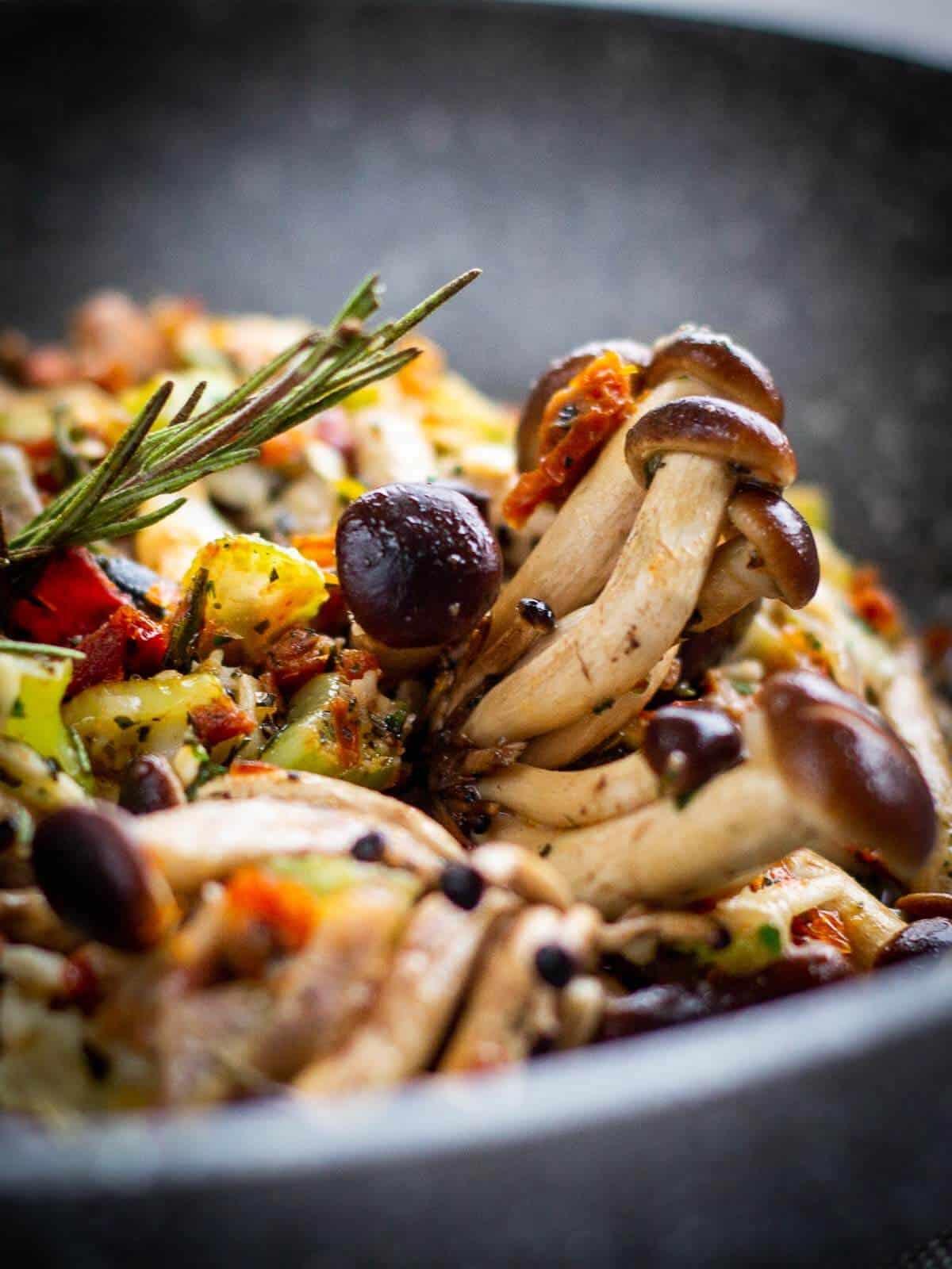 Herbs stuffed mushrooms with a vegetable medley.