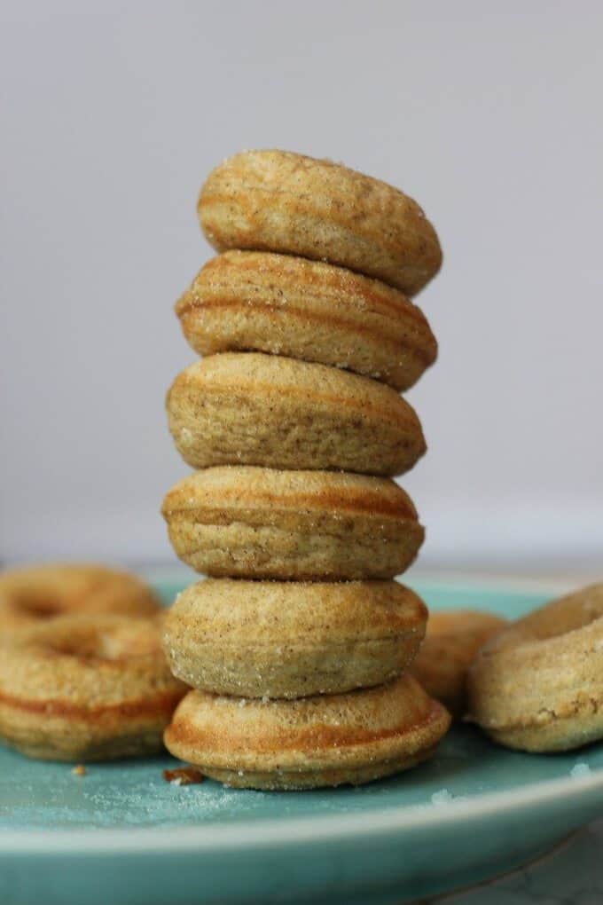 Stack of mini protein donuts on a light blue plate.