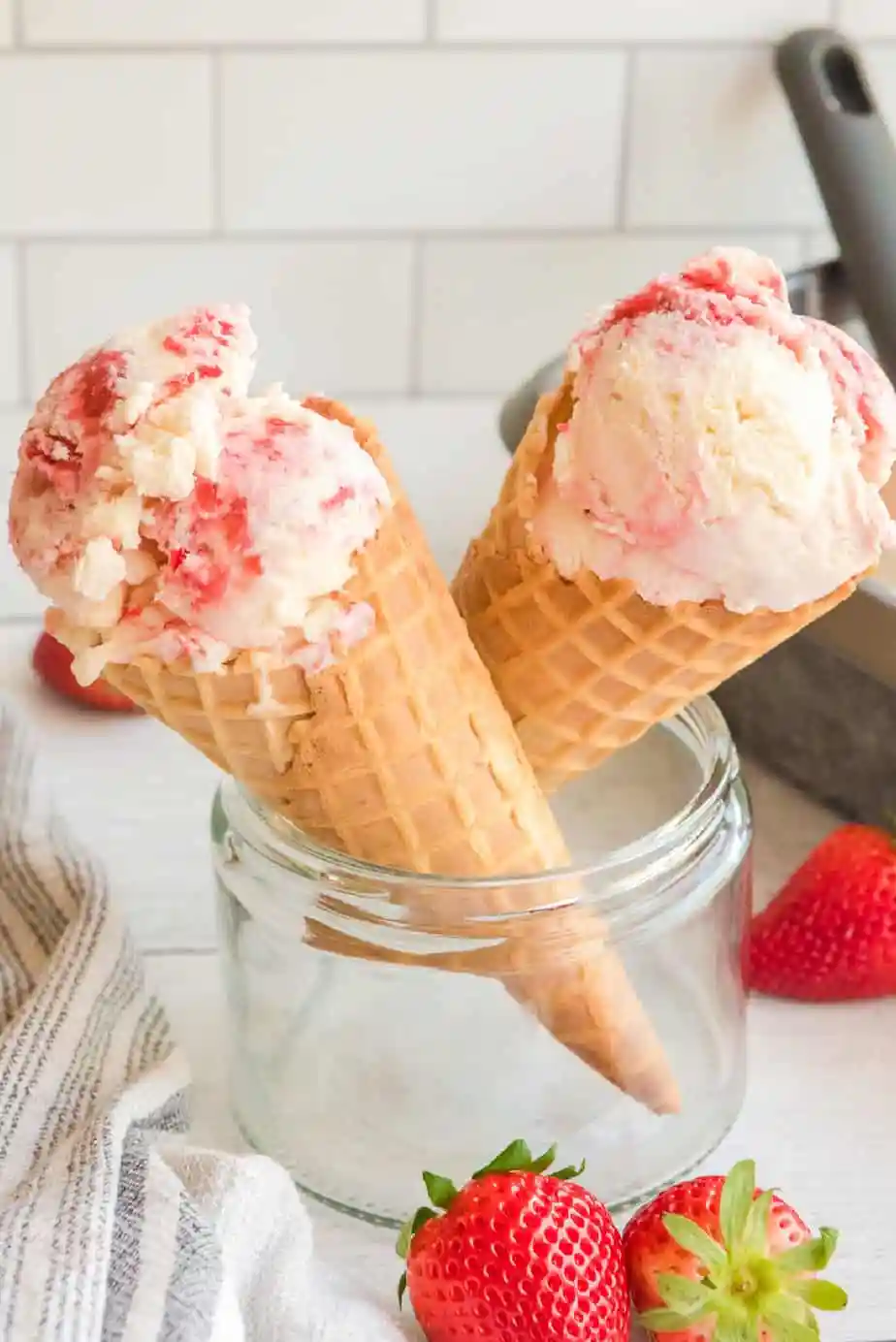 Strawberry swirl ice cream cones in a glass jar.