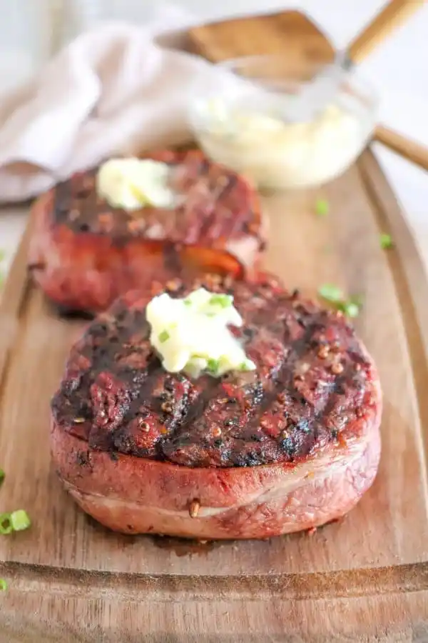 Bacon wrapped steak with butter.