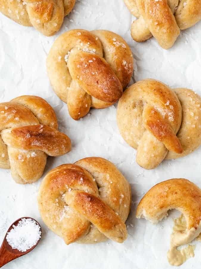 Sourdough soft pretzels on parchment paper.