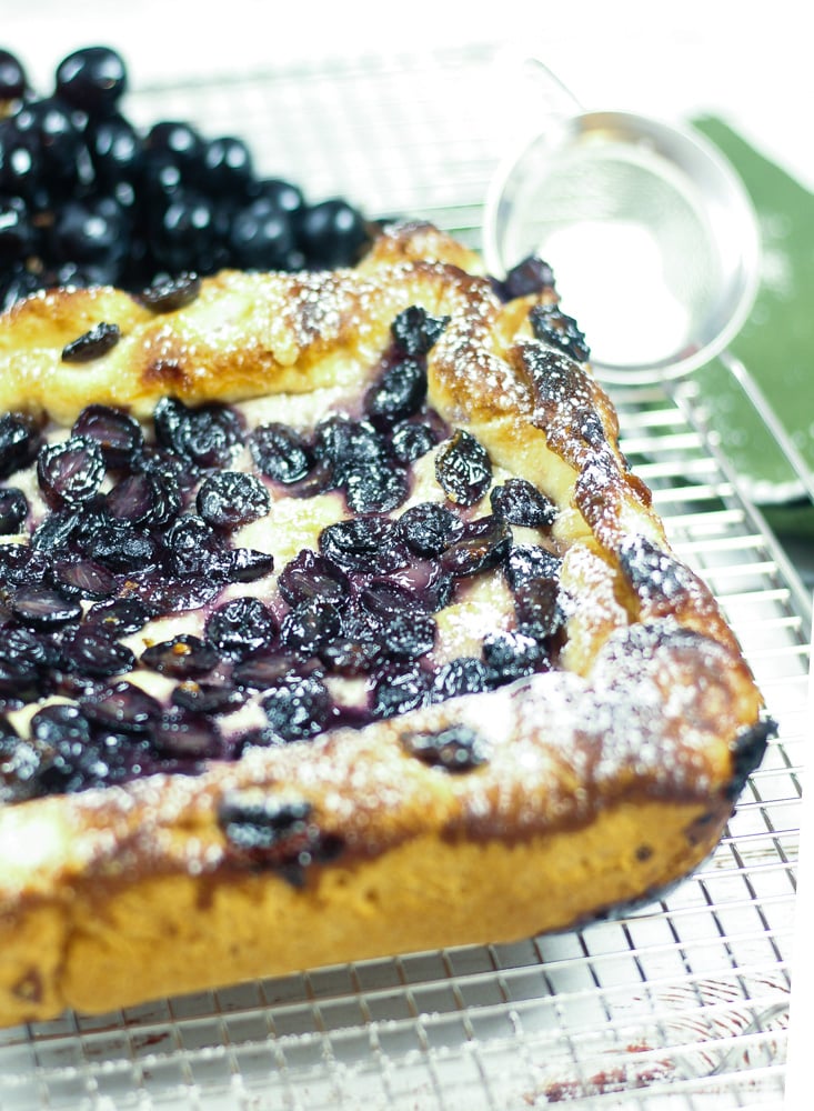 Grape focaccia on a cooling rack.