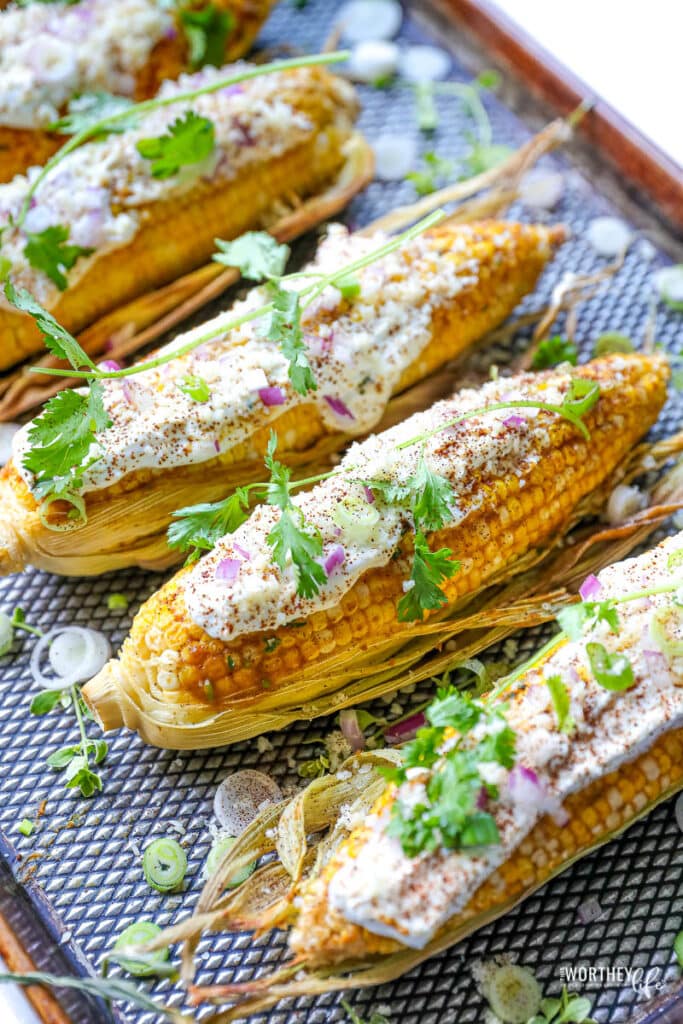 Curry Mexican street corn on a sheet pan.