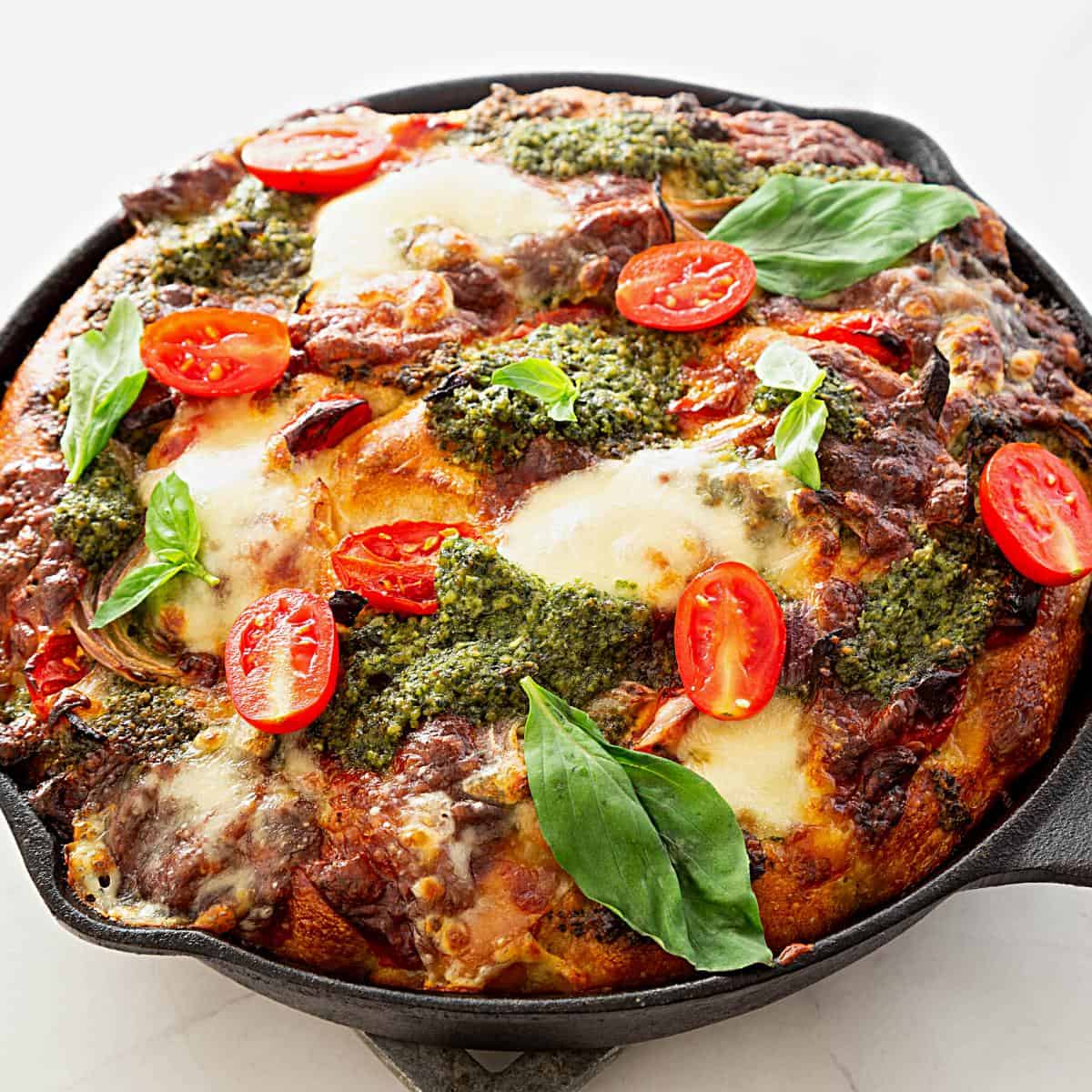 Sourdough focaccia with pesto, basil, tomato and mozzarella.