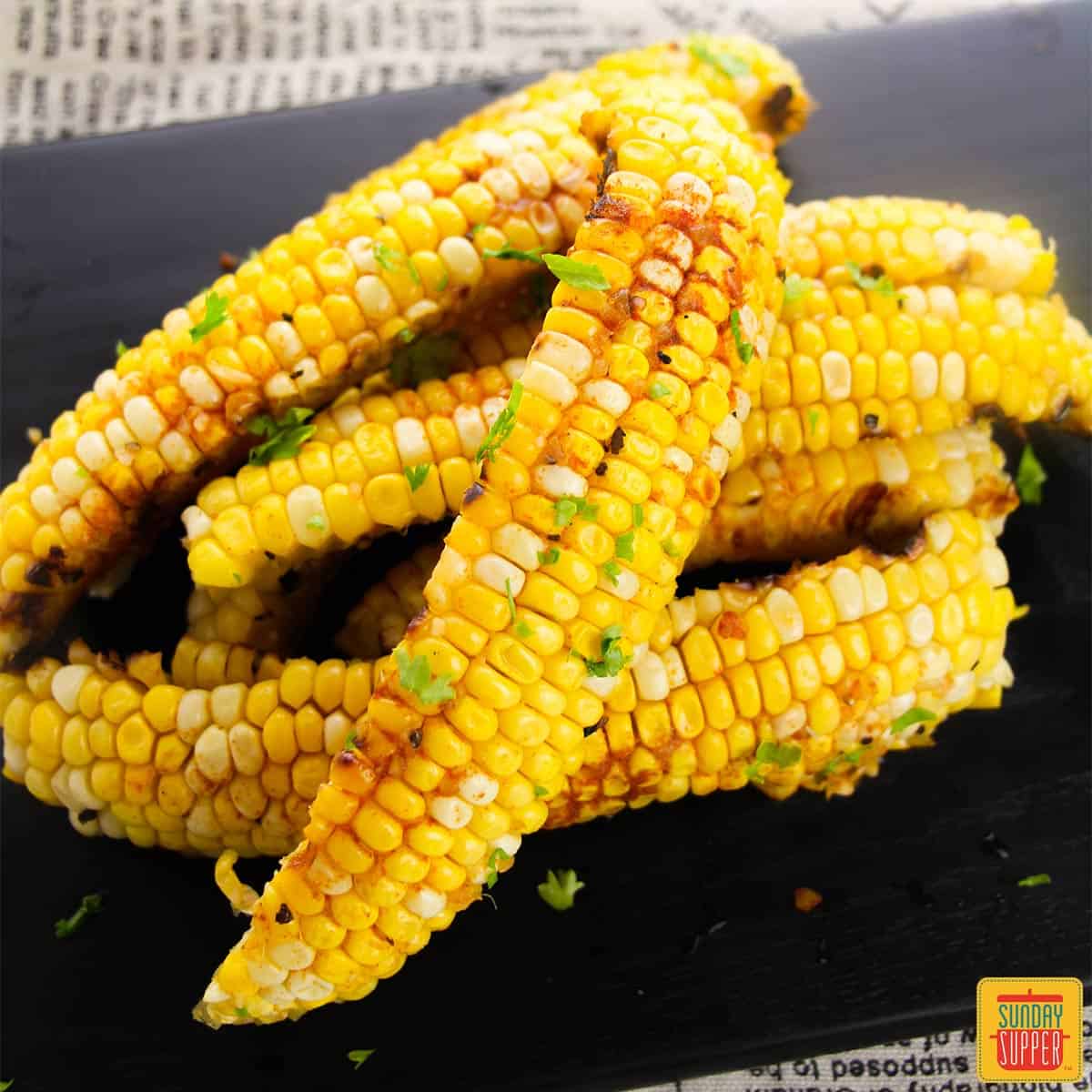 Corn riblets on a black background.