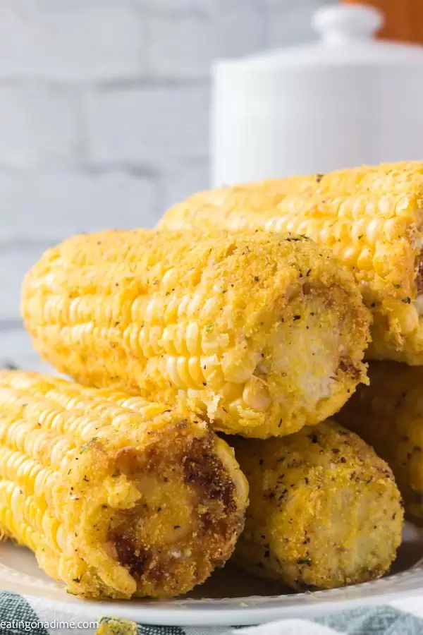 Stack of deep fried corn on the cob.
