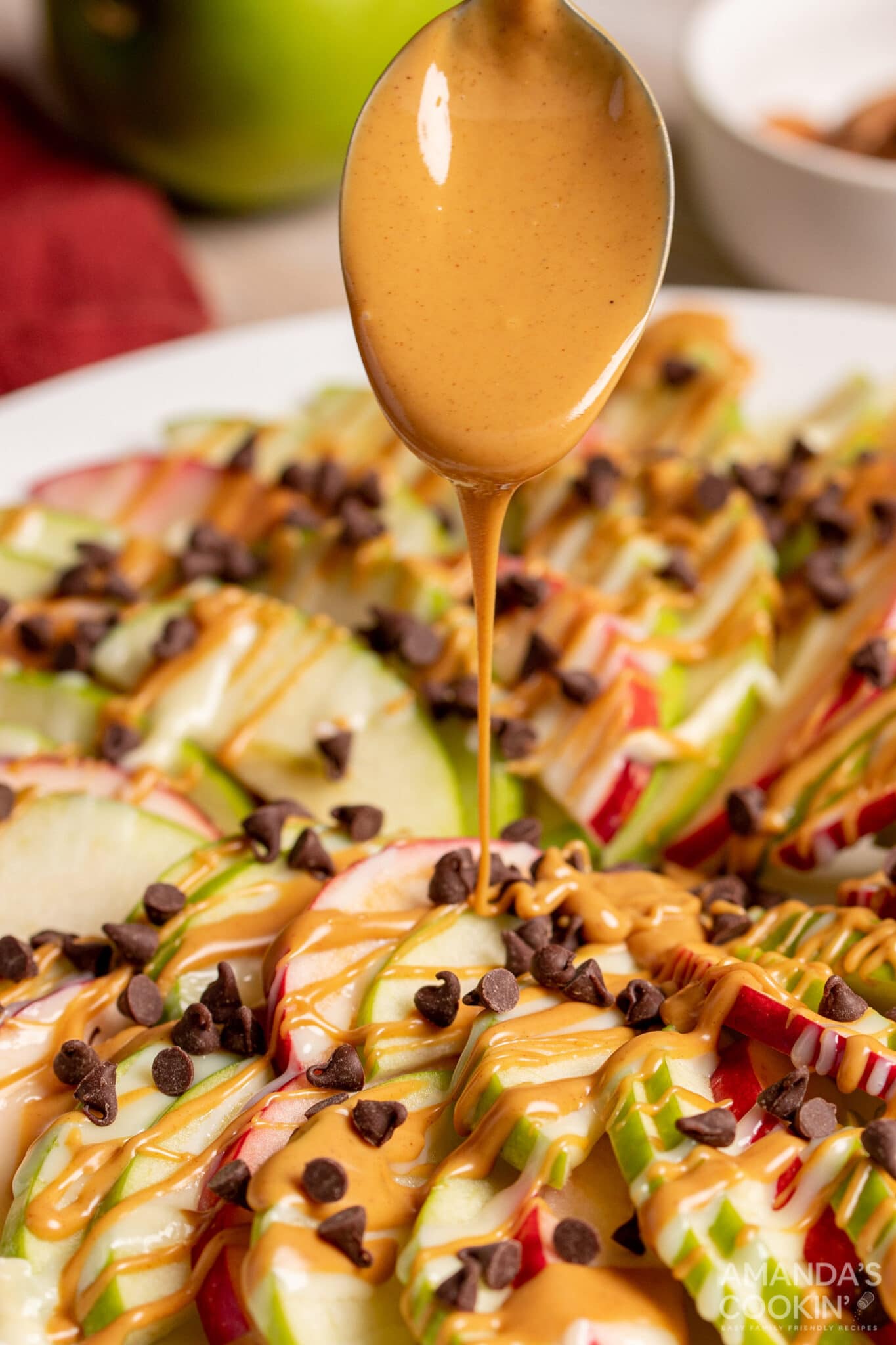Sliced apples drizzled with peanut butter and mini chocolate chips.