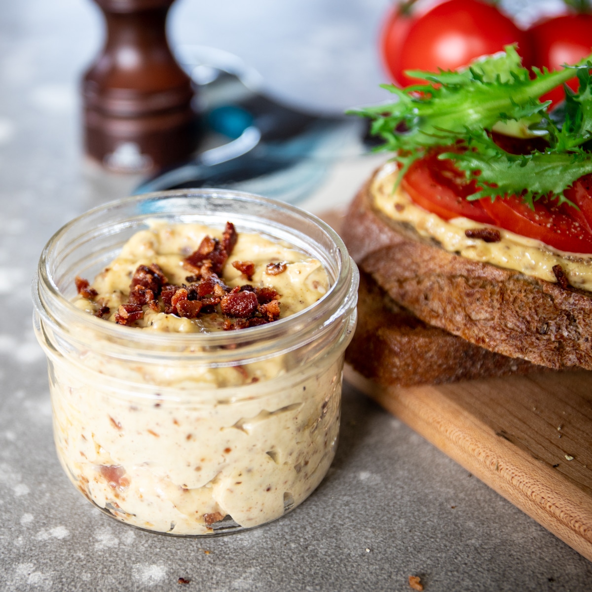 Homemade bacon aioli sauce in a small mason jar.