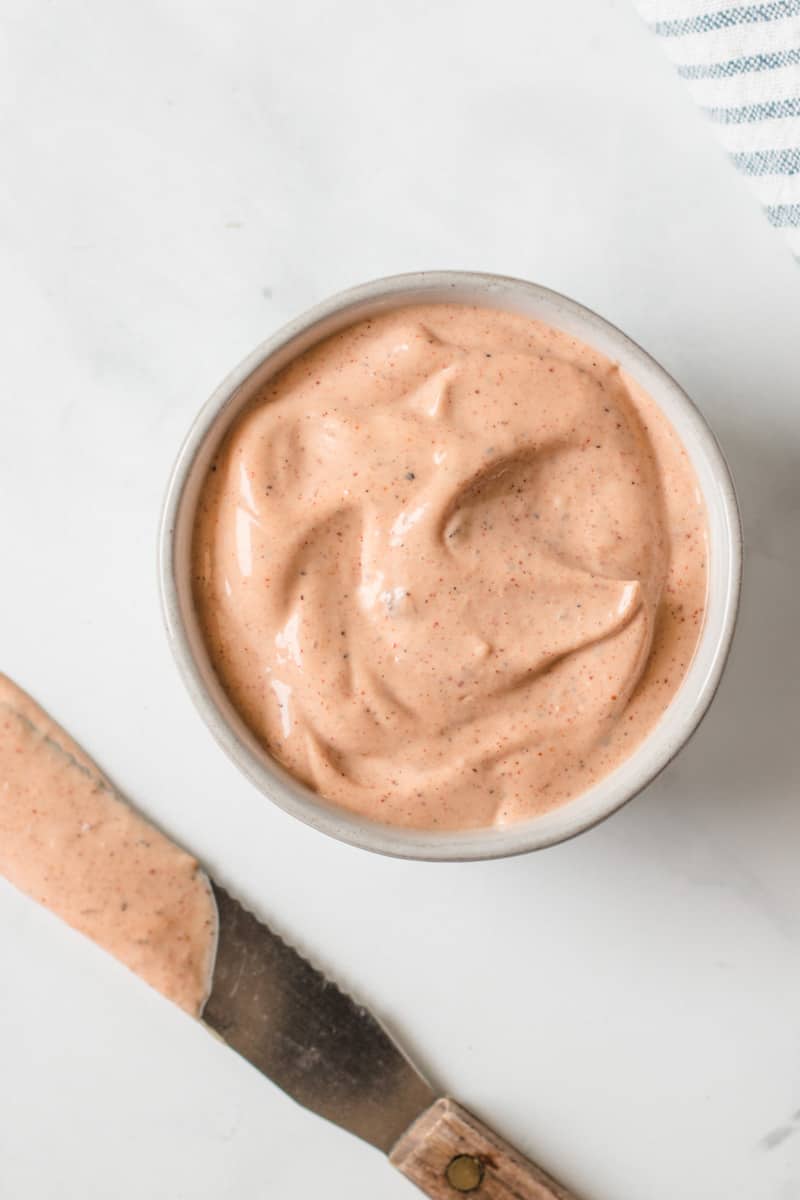 homemade chipotle mayo in a bowl with butter knife.