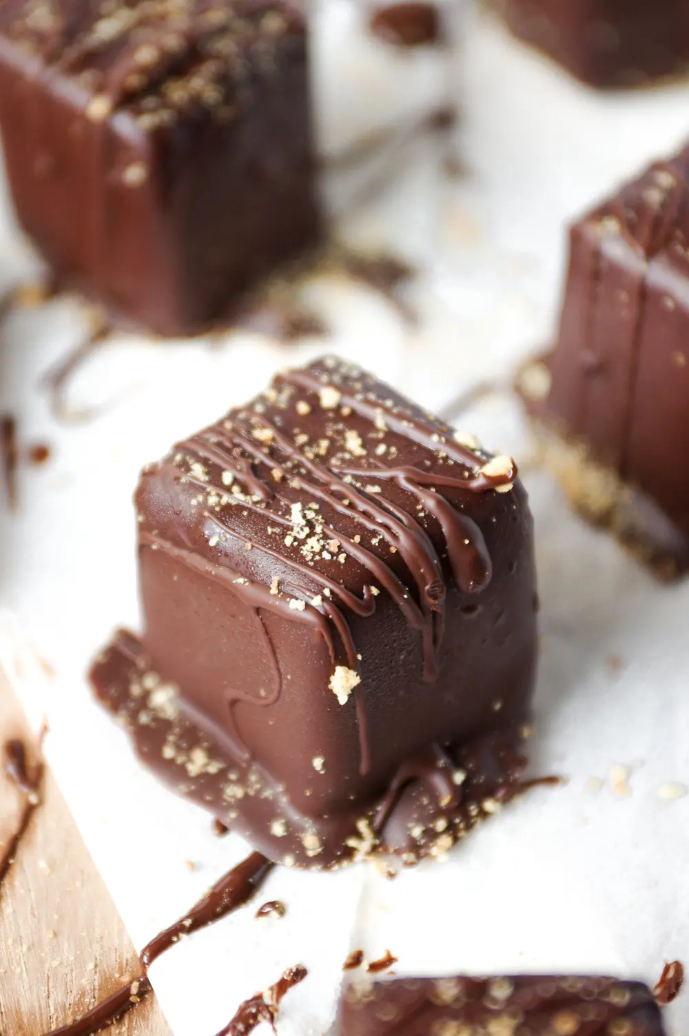 Chocolate covered cheesecake squares.