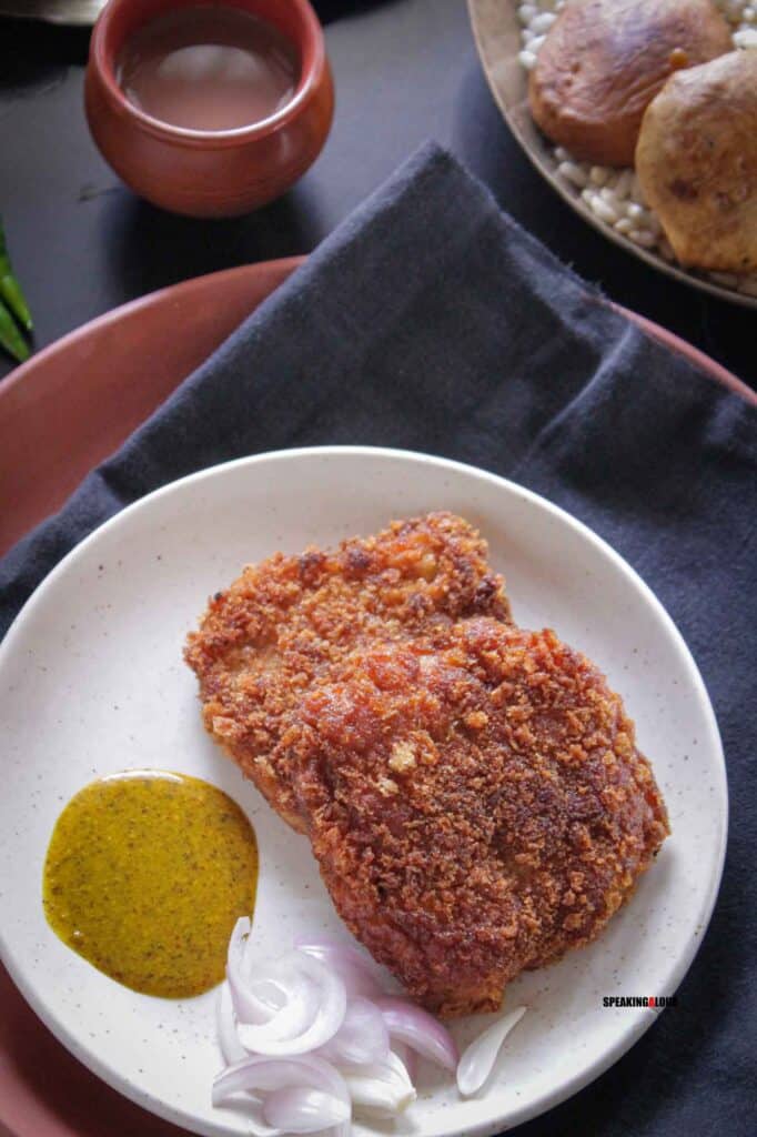 Fried fish on a white plate.