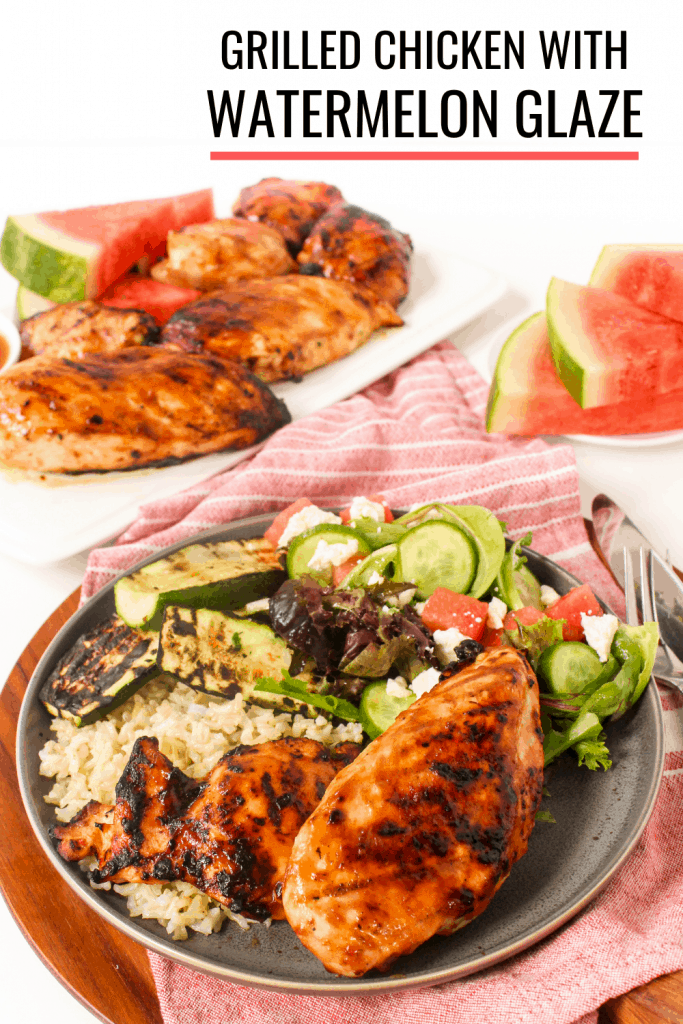 Grilled chicken with watermelon glaze on a plate with rice and vegetables.