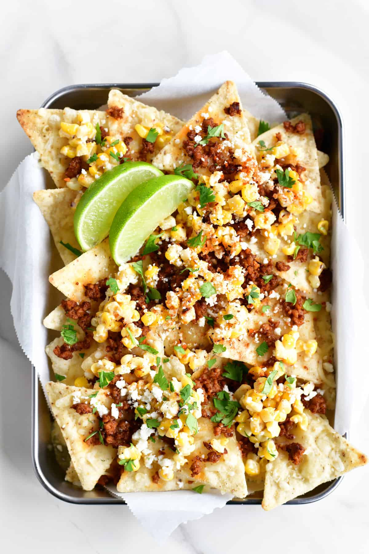 Up close of Mexican street corn nachos.