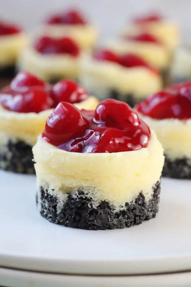 Arrangement of mini cherry cheesecakes.