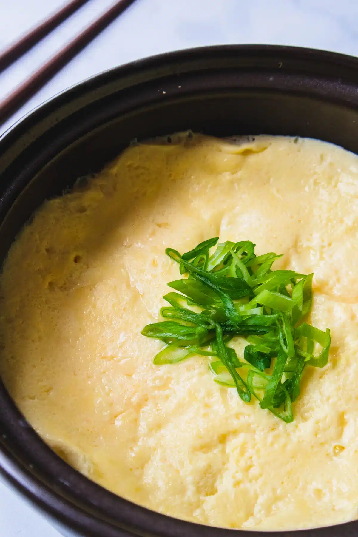 Korean soft steamed eggs in a baking dish.