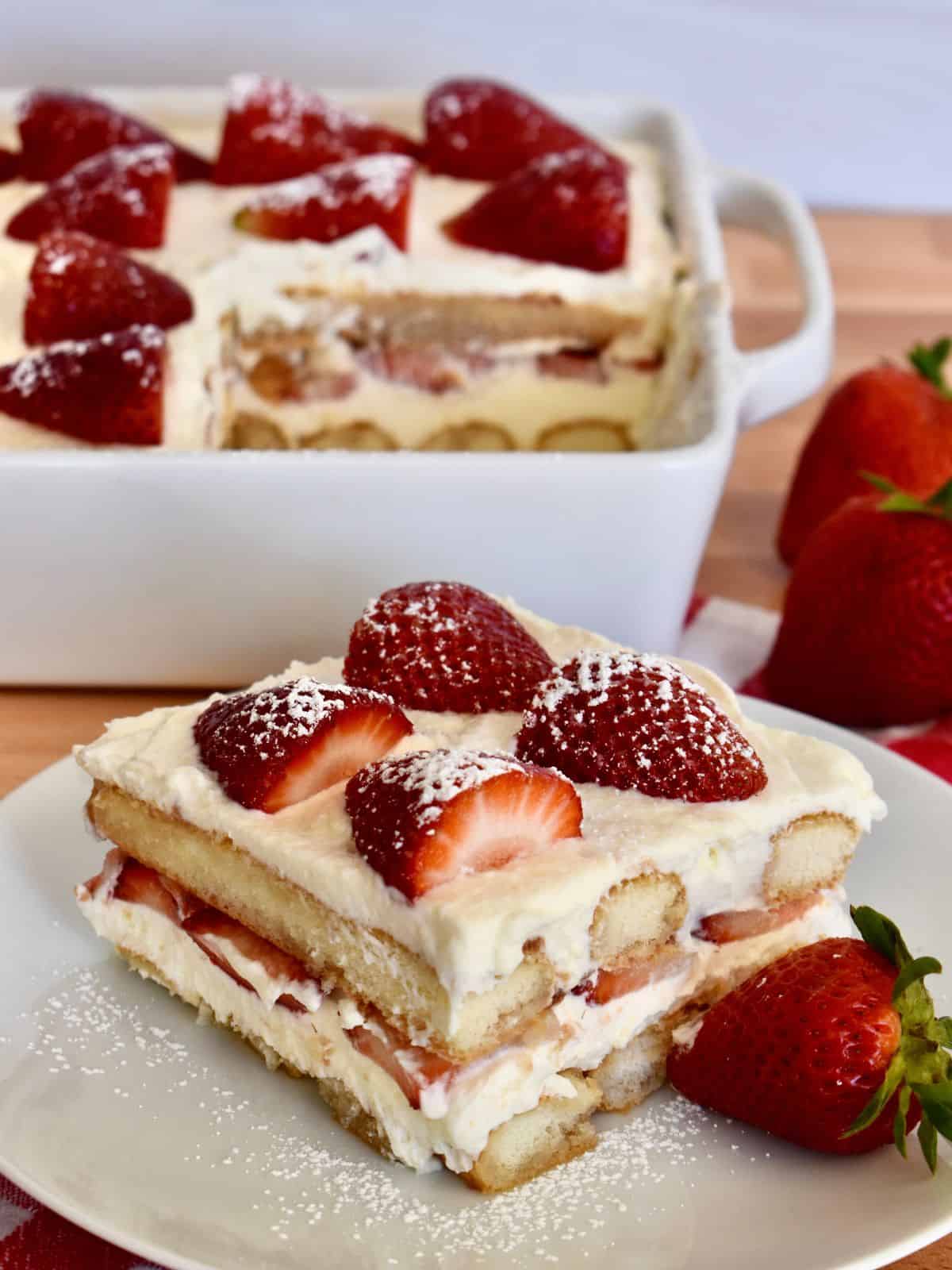 Slice of strawberry tiramisu on a small plate.