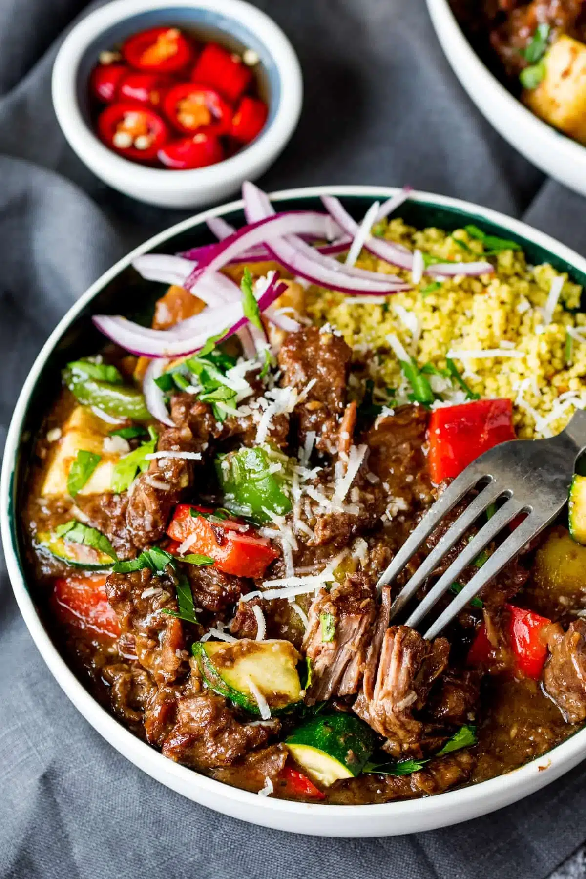 Bowl full of colorful summer beef casserole.