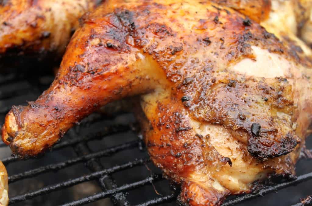 Close up picture Jamaican jerk chicken with leg quarters.