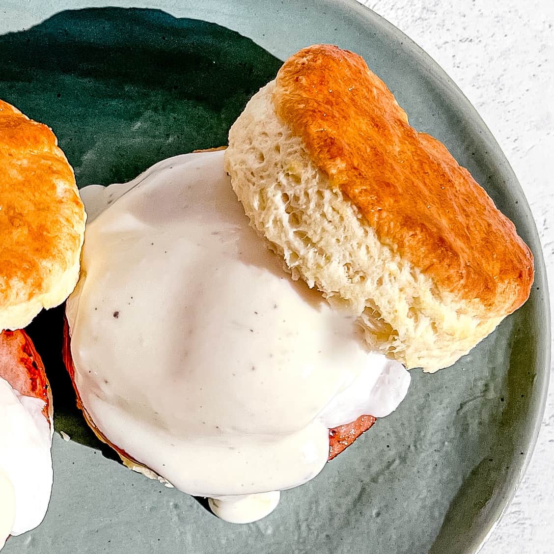 Biscuit eggs benedict on a plate.